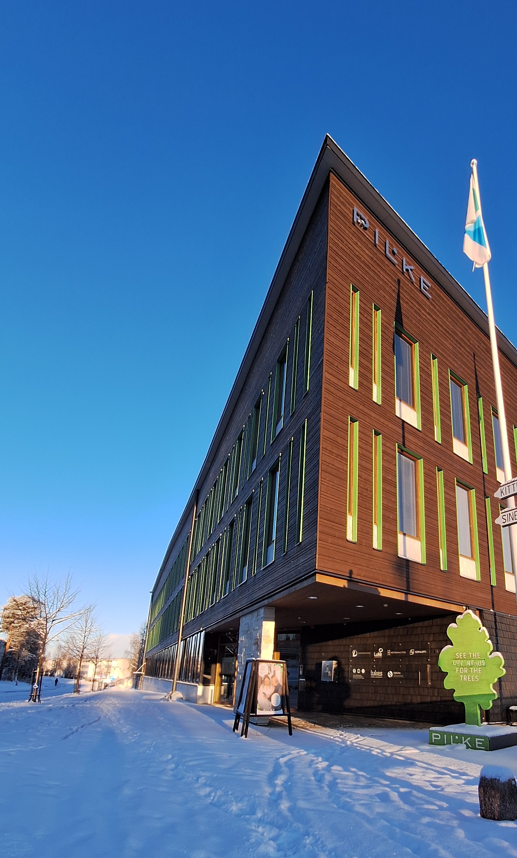 Wooden Pilke House in sunny winter weather.